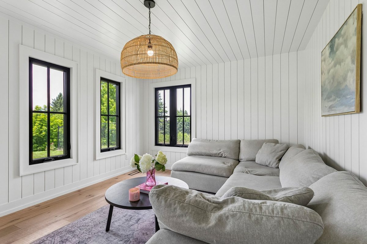 Four-season sunroom with shiplap ceiling